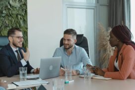 A group of people sitting around a table.