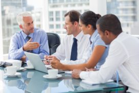 Group of people collaborating in a corner office