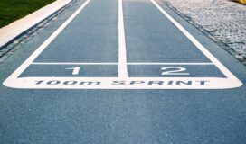 A running track with the word sprint painted on it.