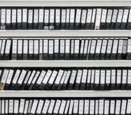 hundreds of binders sitting on selves