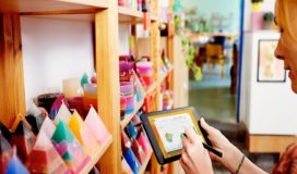 shop keeper analyzing data about candle inventory