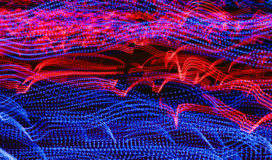 Curves of red and blue light flow from left to right