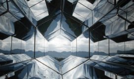 View of a mountain range from a hexagonal glass kaleidoscope