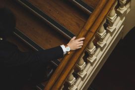 A man in a suit is climbing the stairs.