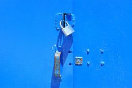 A GDPR-compliant blue door with a padlock on it.