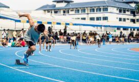 A man is running on a track.