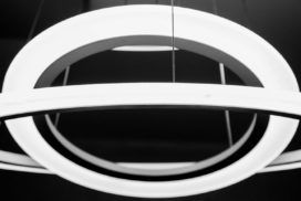 A black and white image of a circular light fixture with no keywords.