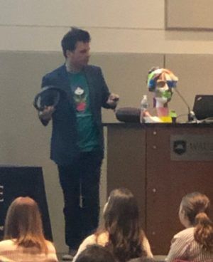 A man giving a presentation to a group of people.