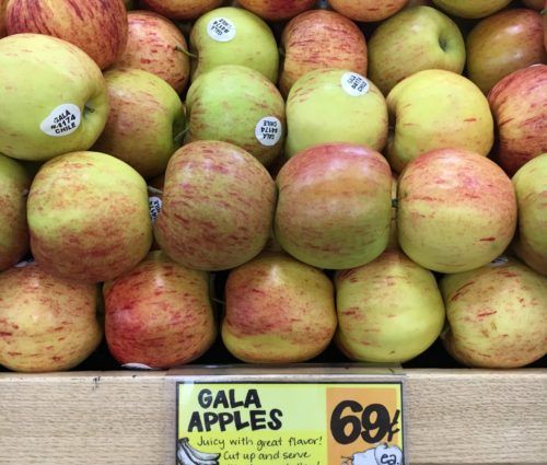 A display of apples in a grocery store.