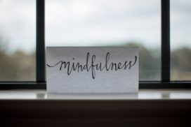 A card with the word mindfulness sitting on a window sill, promoting team mindfulness.