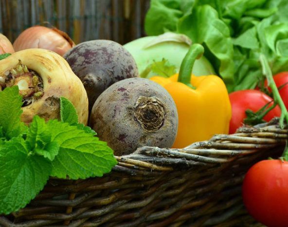 Fresh vegetables in a wicker basket.