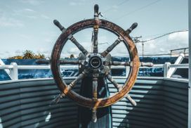 The steering wheel of a boat.