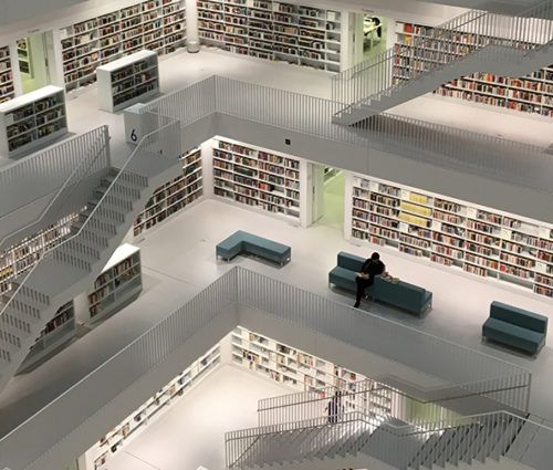 An image of a library with a wide array of bookshelves, showcasing an extensive collection and serving as a data platform for knowledge acquisition.