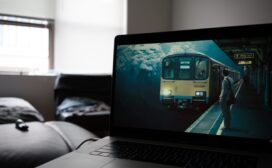 A laptop with a picture of a train on it.