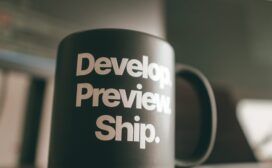 A coffee mug with the words "develon prevent ship" on it, combining both technology and history elements.