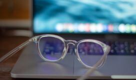 A pair of glasses sitting on top of a laptop, highlighting the integration of computer vision.