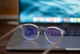A pair of glasses sitting on top of a laptop, highlighting the integration of computer vision.