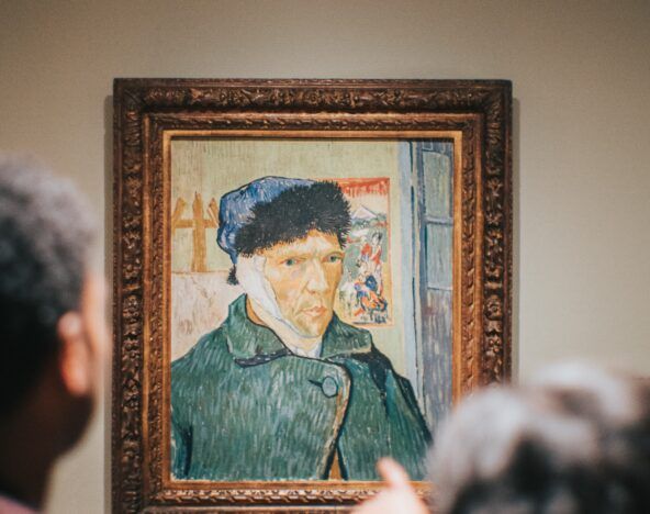 People looking at a Van Gogh painting