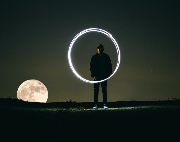 Person behind a light circle