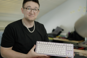 Man holding a computer keyboard