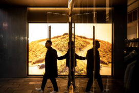 People walking through a revolving door. Photograph by David Lee on Unsplash