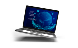 A laptop displays a digital globe and prompts, "What's your carbon footprint?" alongside "Take assessment," blending technology predictions with ecological awareness.