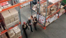 People walking through a warehouse