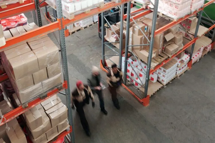 People walking through a warehouse