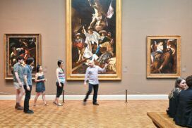 People walking through an art gallery.