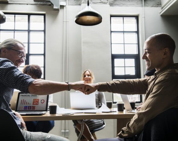 Two people giving a fist bump