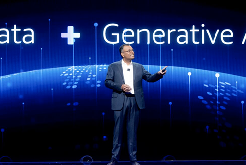 A man standing in front of a data + generational ai sign.