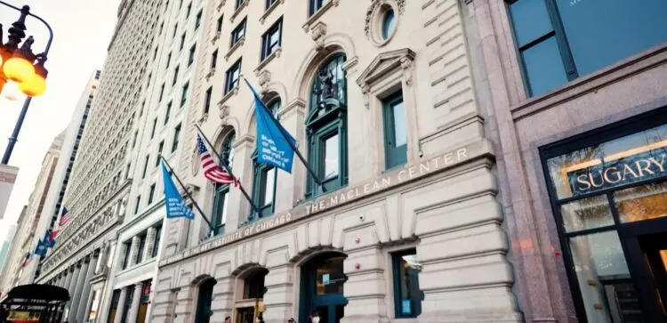 A building with flags on the side of the street.