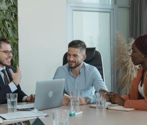 A group of people sitting around a table.