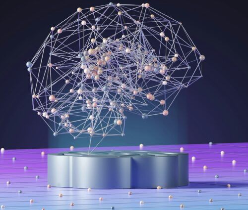 A wireframe model of a brain with connected nodes is displayed on a podium against a purple and blue gradient background.